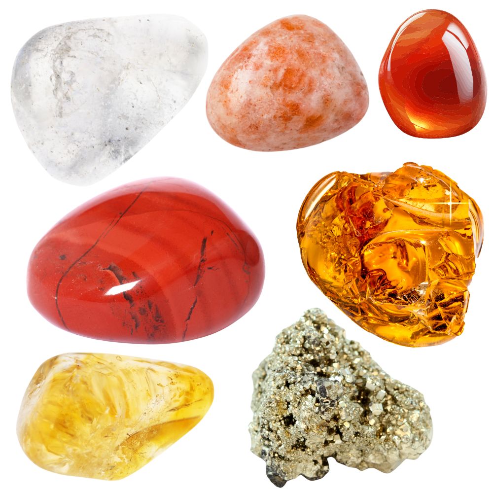 Seven polished crystals arranged on a white background: clear quartz, sunstone, carnelian, red jasper, amber, citrine, and pyrite. Each stone varies in color from clear to fiery red, golden yellow, and metallic gold.
