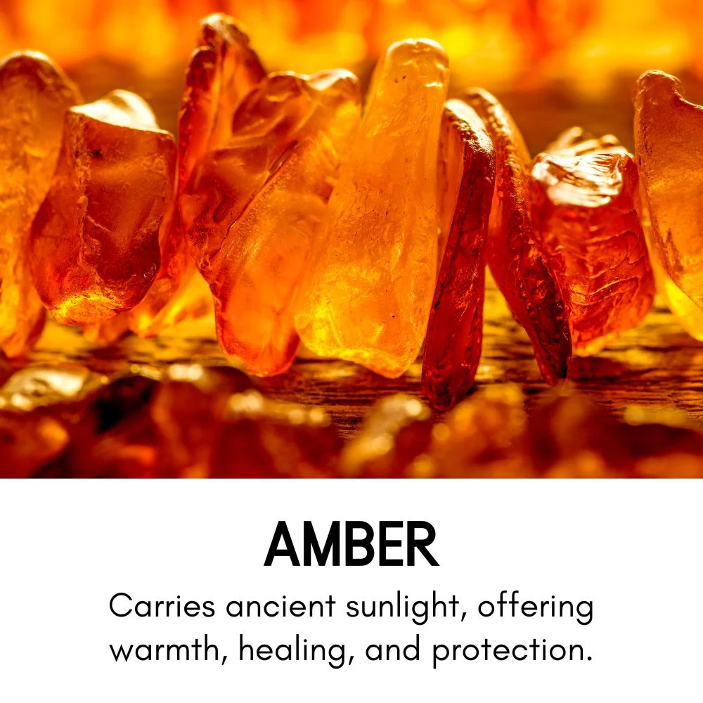 Close-up of raw amber stones glowing with golden-orange hues under warm light. Text below reads: 'Amber – Carries ancient sunlight, offering warmth, healing, and protection.'